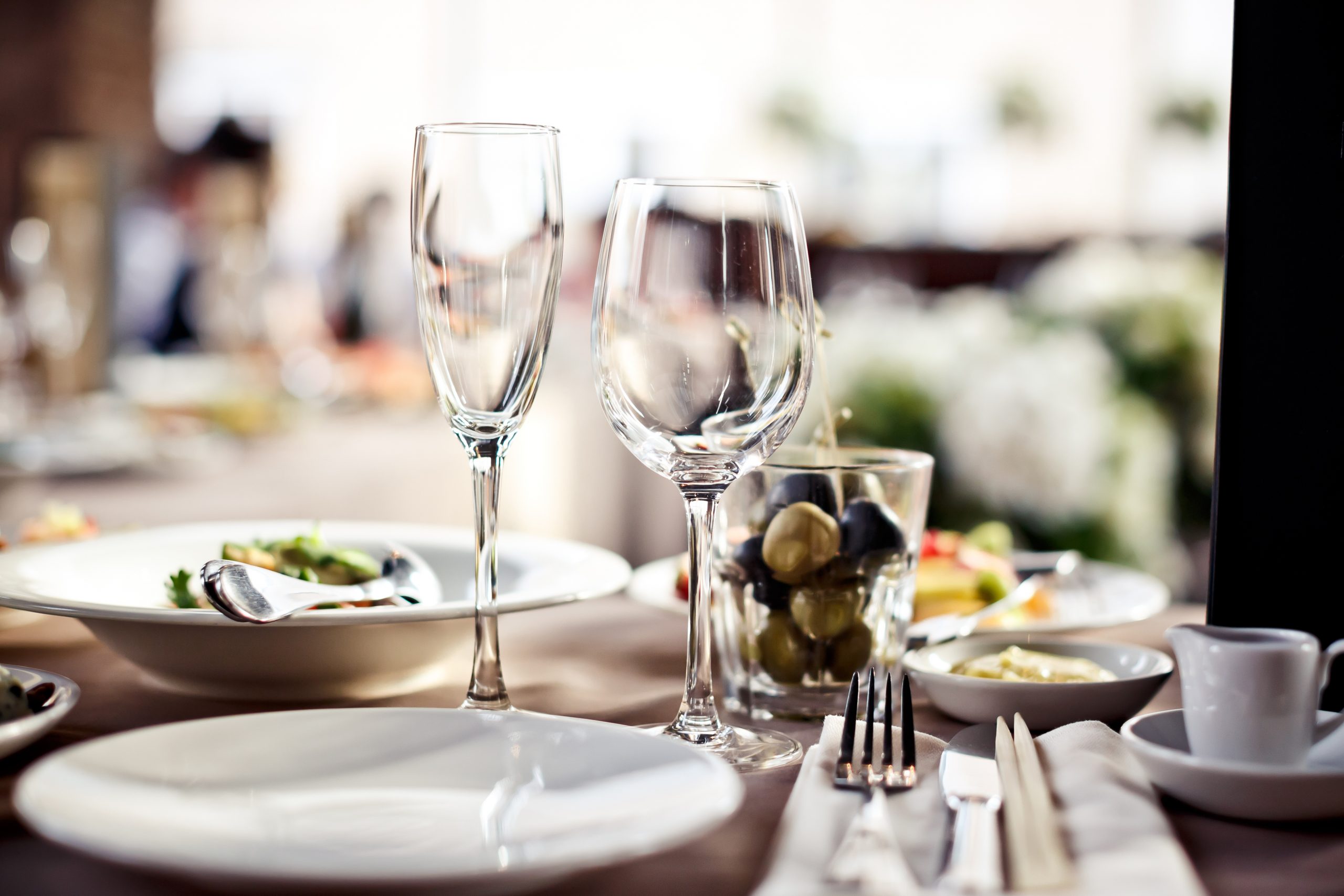 A large set of empty glasses in a restaurant